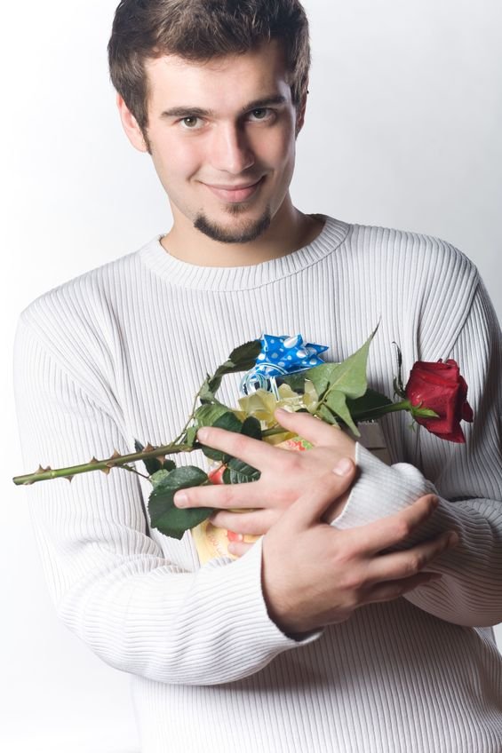 young man with gifts and rose